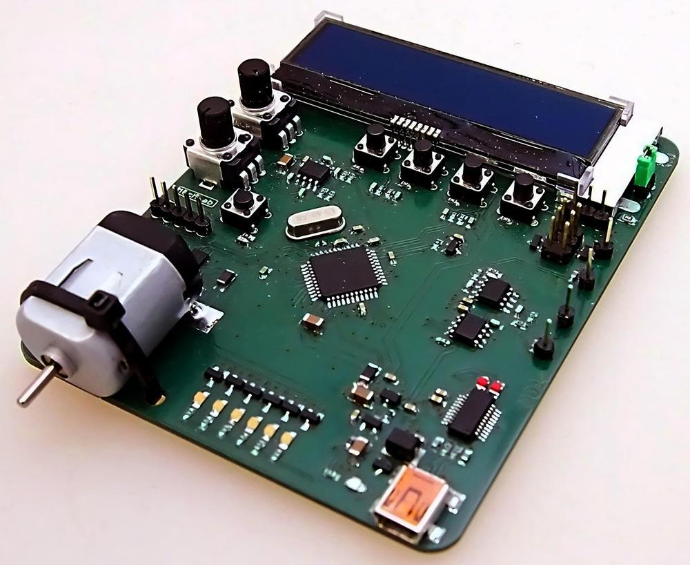 A board with a bunch of electrical parts 